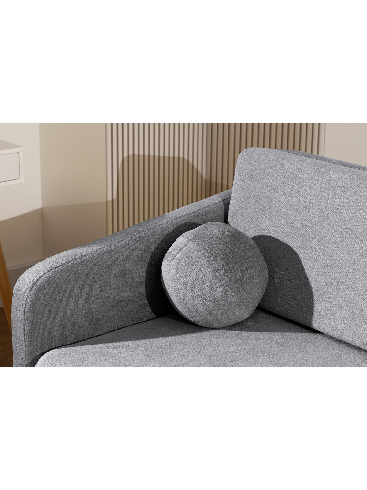 Sofa Zeldia 135 szara z funkcją spania, poduszka okrągła w nowoczesnym stylu